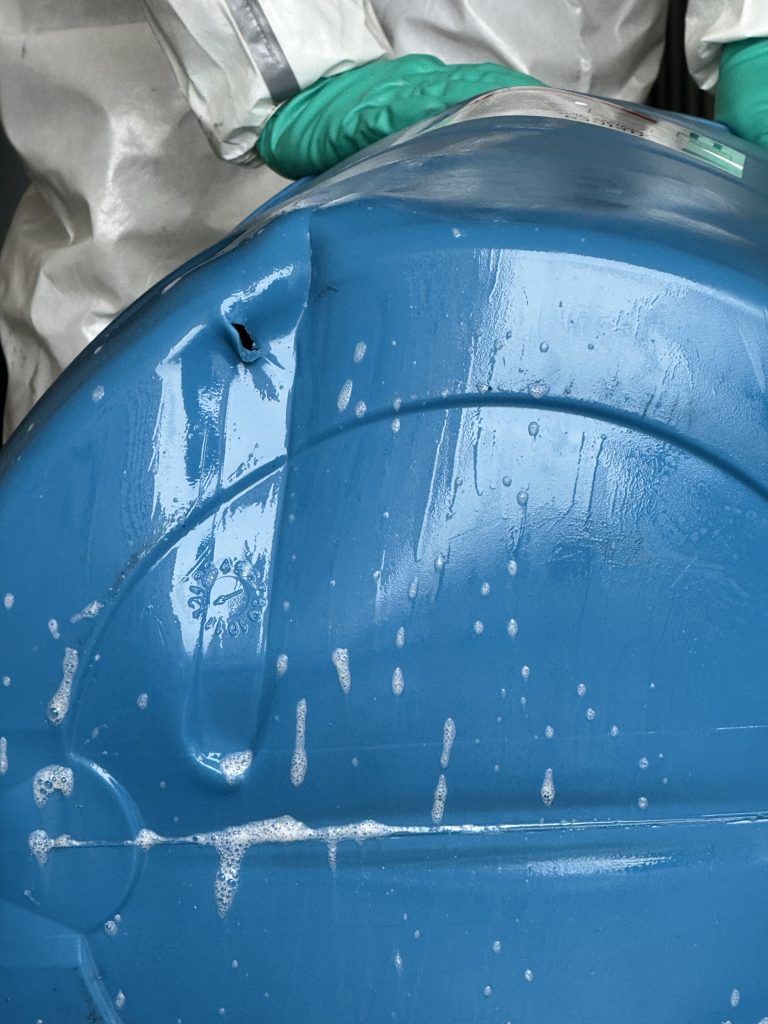 Puncture on the bottom of the drum.