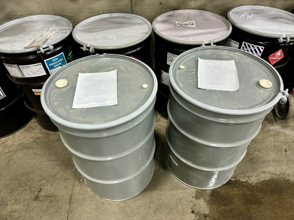 The impacted oil dry waste was scooped up and placed into a 55-gallon open top steel drum, while the absorbent boom was placed in an additional drum.