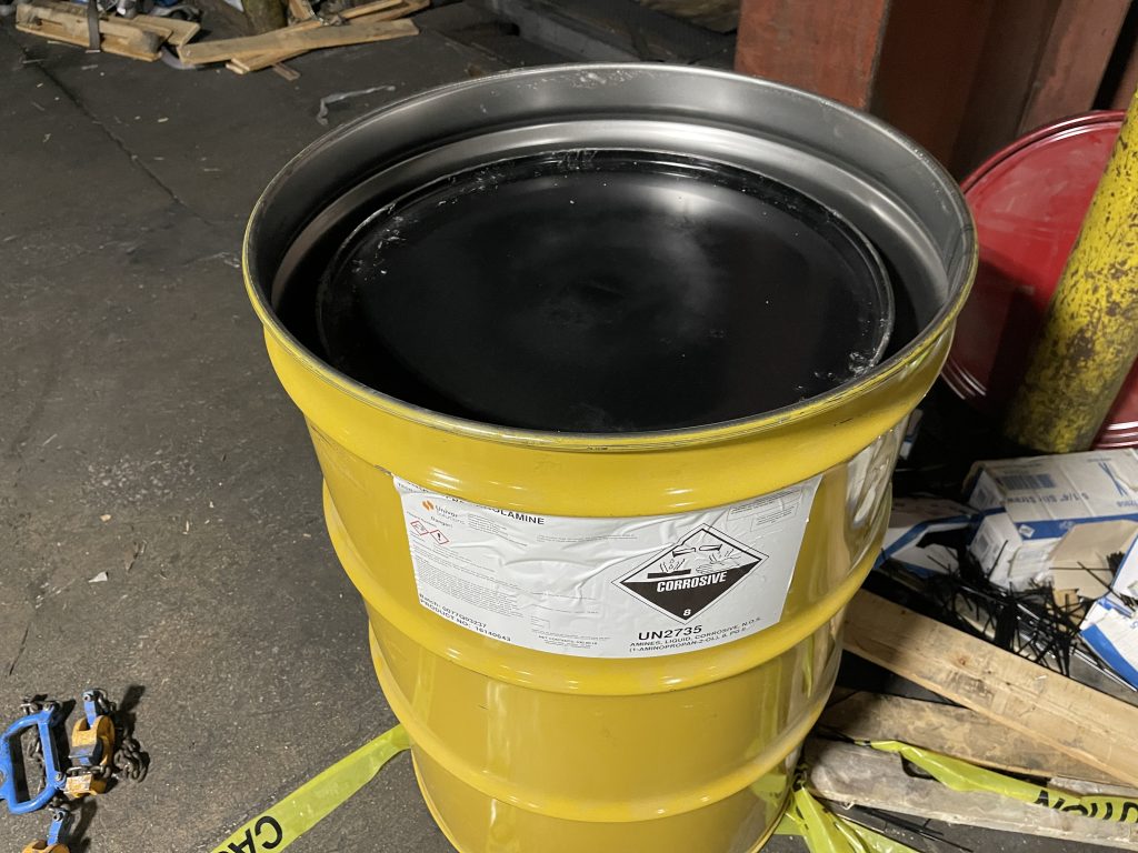 overpacking a damaged drum with corrosive liquid