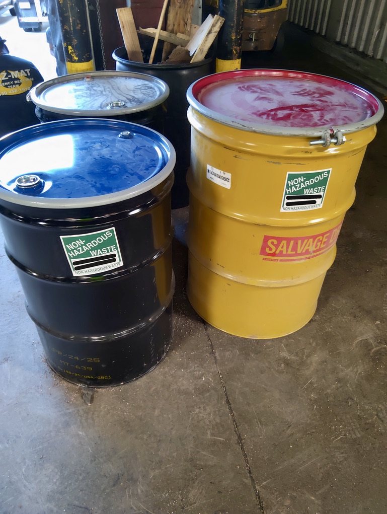 remediation of trailer solidified product waste into a designated drum, for waste.